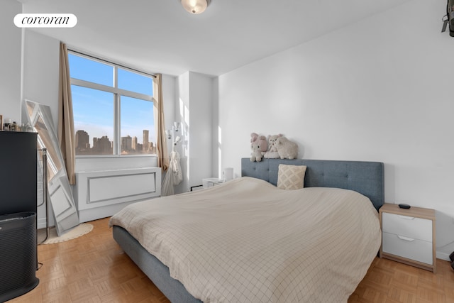 bedroom featuring visible vents and a view of city