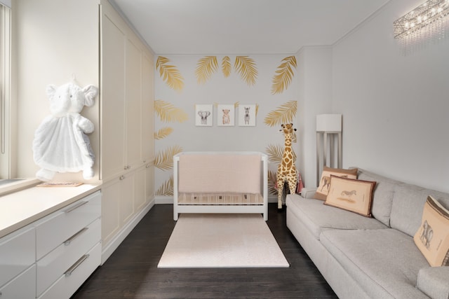 bedroom with dark wood-style flooring