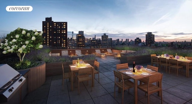 view of patio terrace at dusk