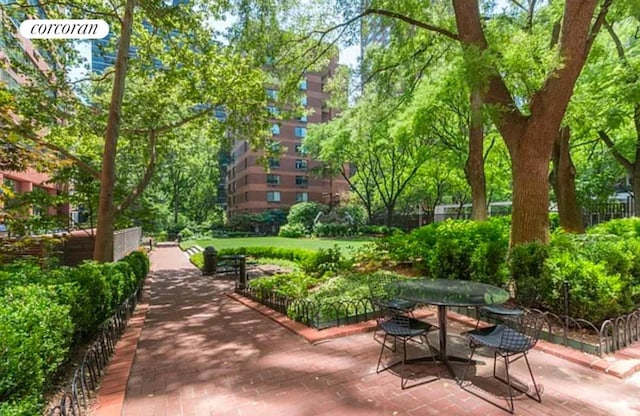 surrounding community with a patio area