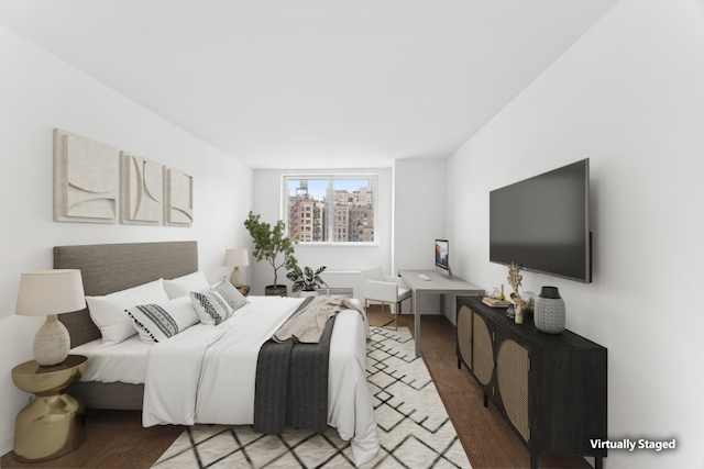 bedroom with hardwood / wood-style flooring