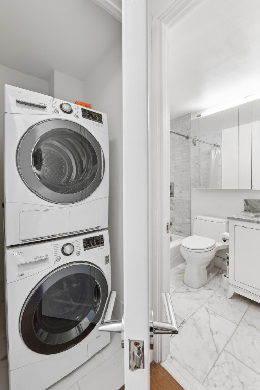 washroom with stacked washer / dryer