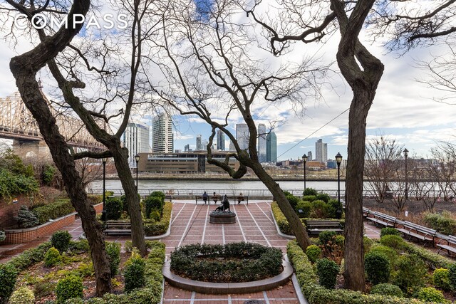 view of home's community featuring a city view and a patio area