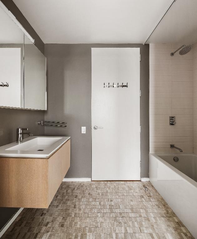 bathroom with vanity and walk in shower