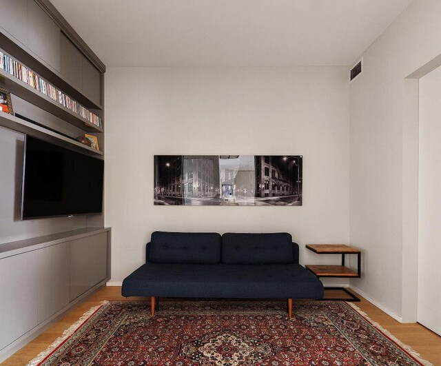 office area with a water view and light wood-type flooring