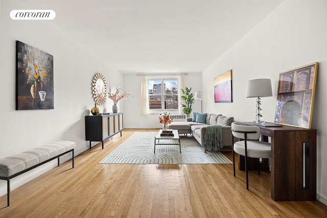 living room featuring light wood-style flooring and visible vents