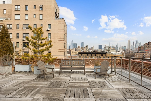 wooden terrace featuring a city view