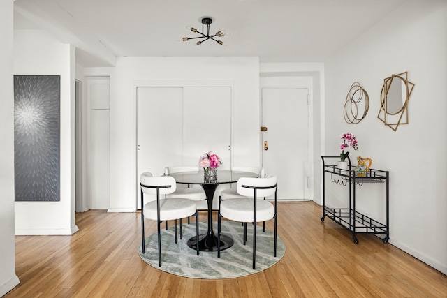 dining space featuring light wood-type flooring