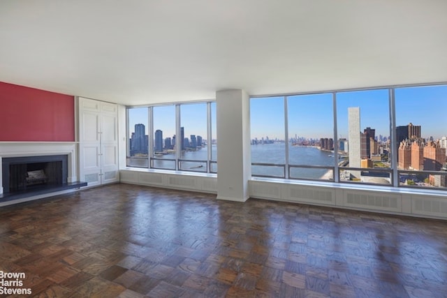 living room featuring a view of city and a fireplace with raised hearth