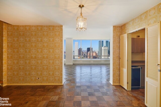 unfurnished room with ceiling fan, a healthy amount of sunlight, and carpet