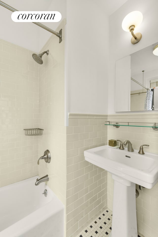 21 E 10th St Unit 2De, New York City, NY 10003 - full bathroom with shower / tub combination, a sink, wainscoting, and tile walls