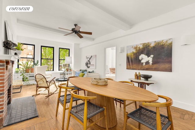 21 E 10th St Unit 2De, New York City, NY 10003 - dining area with ceiling fan, beamed ceiling, and a fireplace