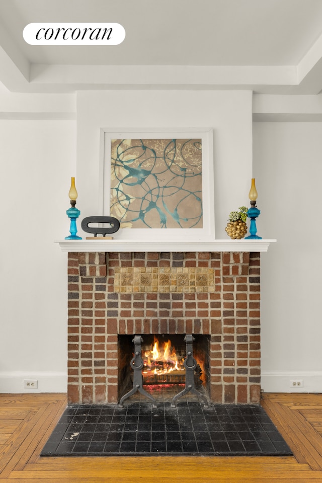 interior details with a fireplace and baseboards