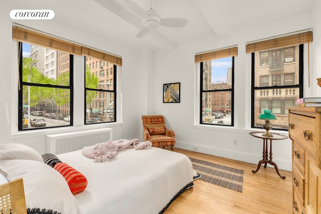 21 E 10th St Unit 2De, New York City, NY 10003 - bedroom featuring light wood finished floors, baseboards, and beamed ceiling