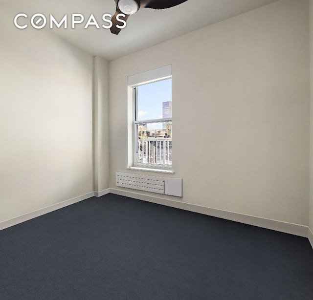 unfurnished room featuring ceiling fan and radiator heating unit