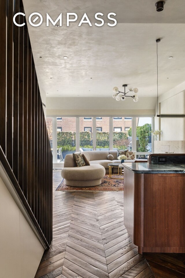 empty room featuring lofted ceiling and dark parquet floors