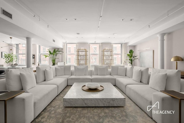 living room featuring ornate columns