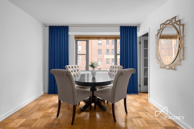 dining area featuring baseboards