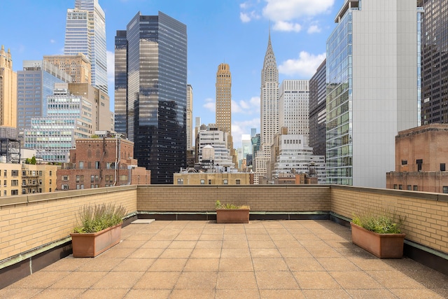 view of patio / terrace featuring a city view