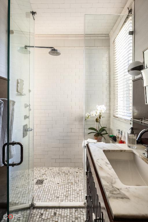 bathroom featuring vanity and walk in shower