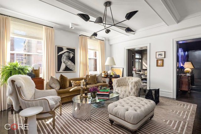 sitting room with an inviting chandelier, crown molding, dark hardwood / wood-style floors, and beamed ceiling