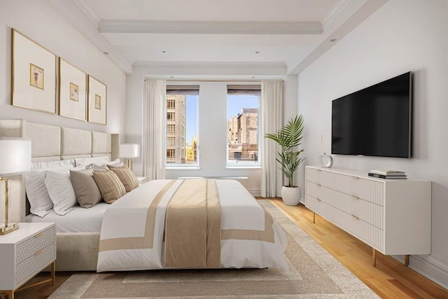 bedroom featuring crown molding and light hardwood / wood-style flooring