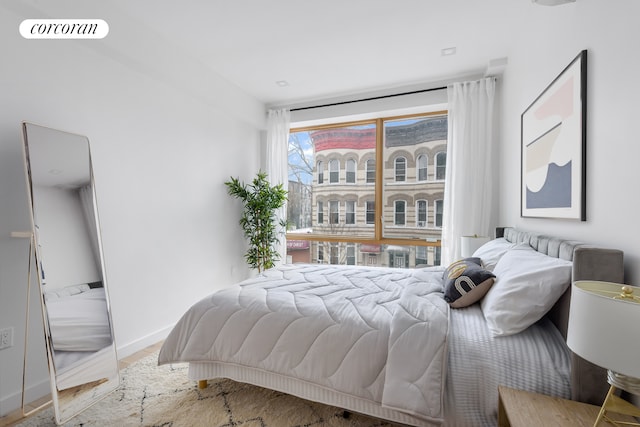 bedroom featuring baseboards and visible vents