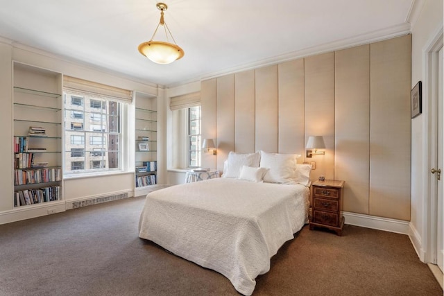 bedroom with dark carpet and ornamental molding