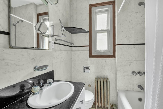 bathroom with shower / bath combo, toilet, tile walls, and radiator heating unit