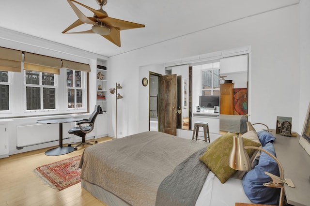 bedroom featuring ceiling fan and wood finished floors