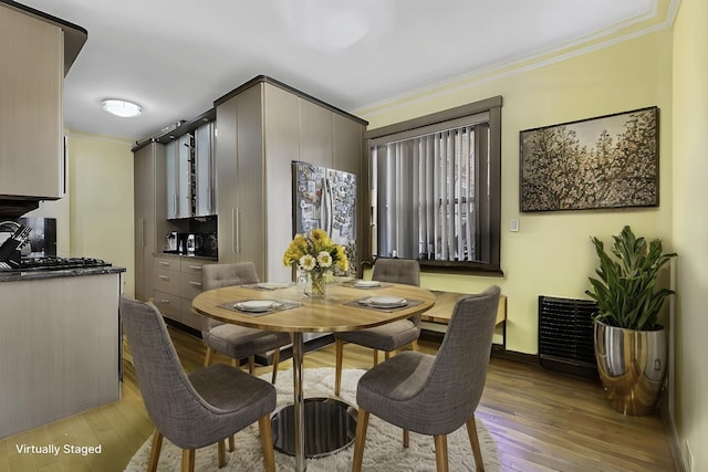 69-11 Yellowstone Blvd Unit A-51, New York City, NY 11375 - dining room with light wood finished floors and ornamental molding