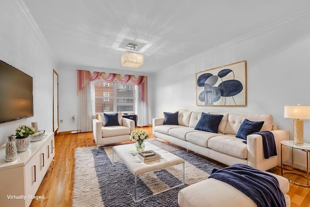 living area with light wood-style floors and ornamental molding