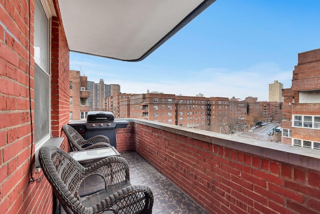 69-11 Yellowstone Blvd Unit A-51, New York City, NY 11375 - balcony featuring a view of city and a grill