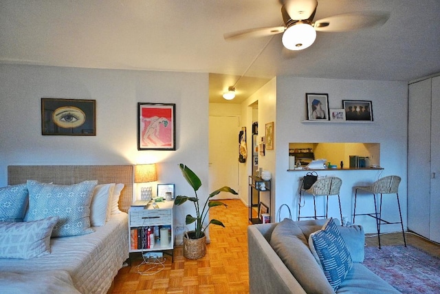 living room featuring parquet floors and ceiling fan