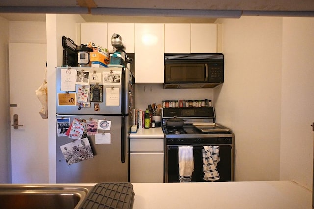 kitchen with white cabinetry and black appliances