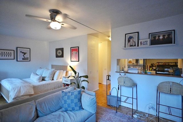 bedroom with dark parquet flooring and ceiling fan