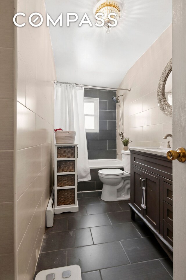 full bathroom featuring vanity, toilet, and shower / bath combo with shower curtain