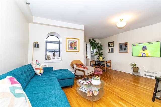 living area with wood finished floors and visible vents