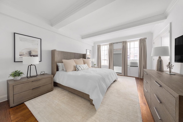 bedroom featuring beam ceiling, light wood-style floors, and ornamental molding