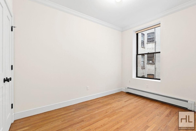 unfurnished room featuring light wood-type flooring, a baseboard radiator, ornamental molding, and baseboards