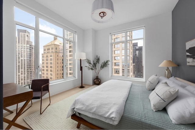 bedroom featuring a city view