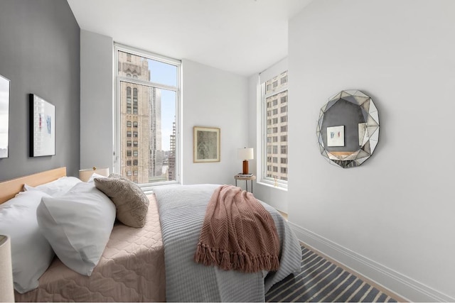 bedroom featuring carpet floors and multiple windows