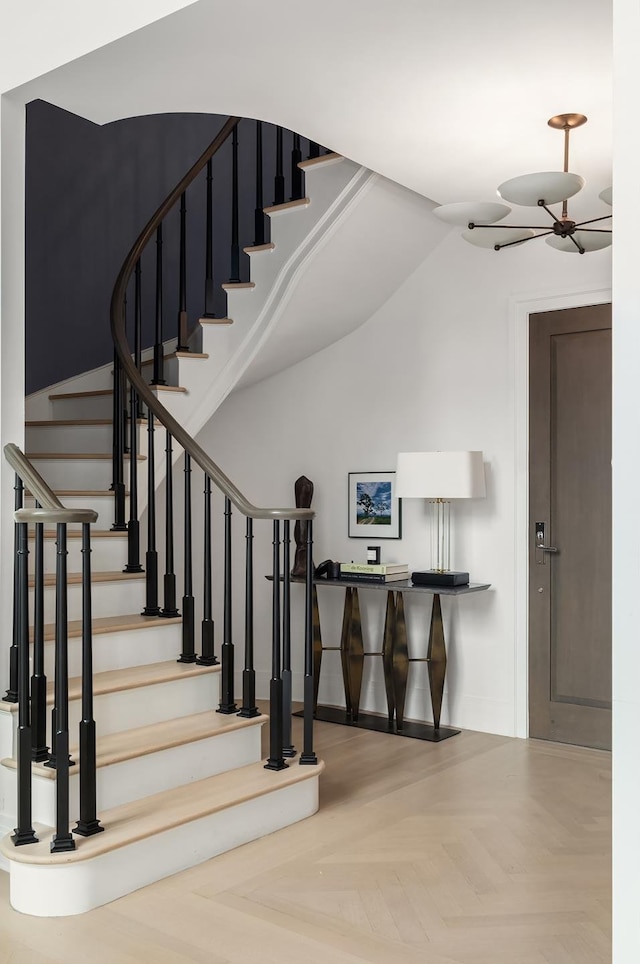 staircase featuring baseboards