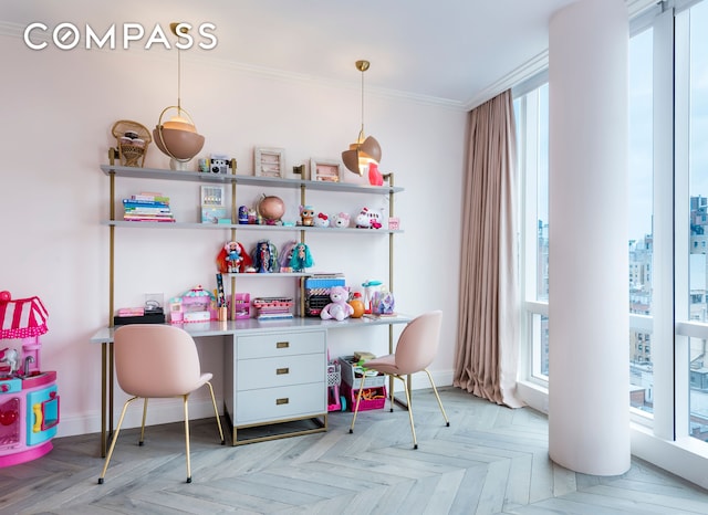 office featuring crown molding, baseboards, and a wealth of natural light