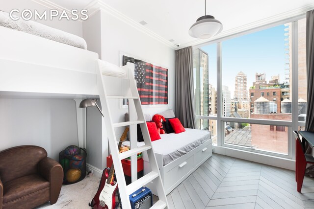 bedroom with a view of city and ornamental molding