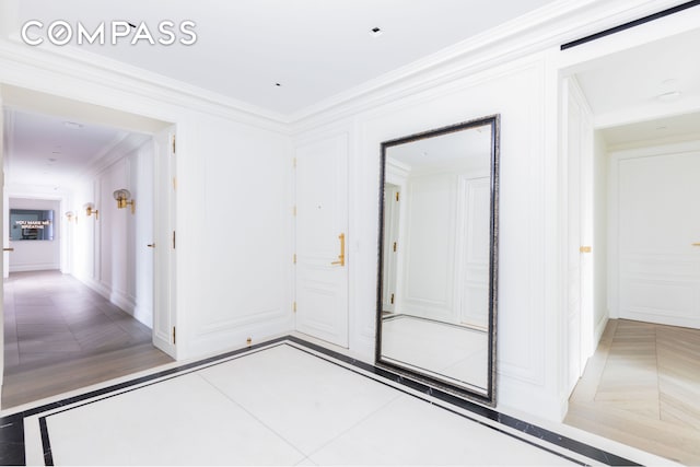 unfurnished room with ornamental molding