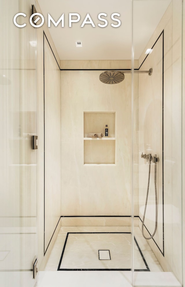bathroom featuring a shower stall