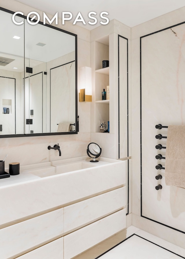 bathroom featuring visible vents and vanity