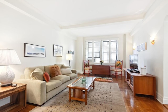 living room featuring beam ceiling and hardwood / wood-style flooring