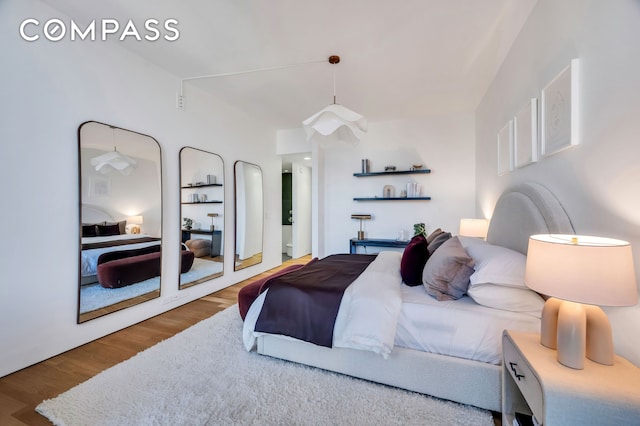 bedroom featuring wood finished floors